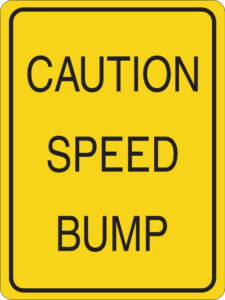Caution speed bump sign